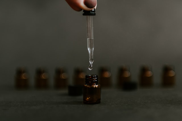 a dropper with clear liquid
